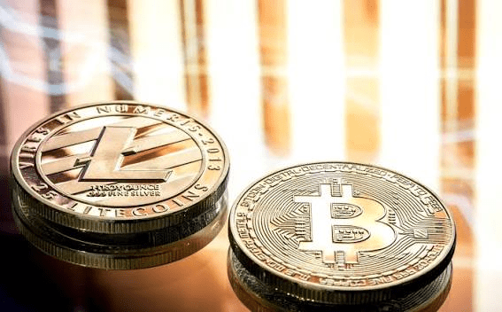 Litecoin and Bitcoin cryptocurrency coins representing blockchain technology